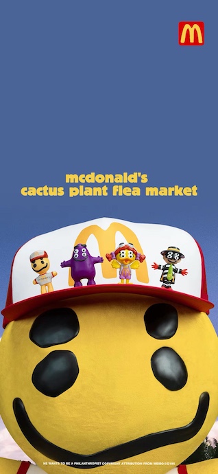 A giant yellow four-eyed smiley face wearing a McDonald's CPFM trucker hat with mini figures of Grimace, Birdie, and Hamburglar on top against a blue sky.