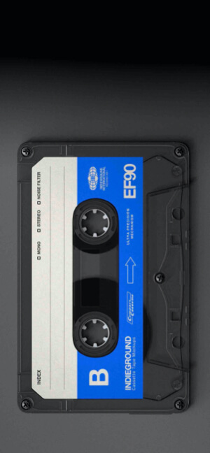A vertical close-up of a vintage EF90 cassette tape with blue and white labels set against a dark, matte background.