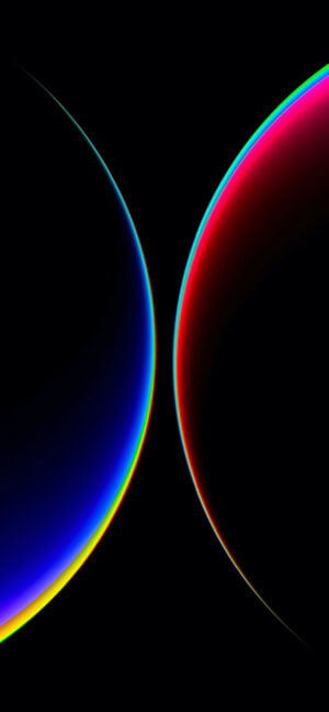 A high-contrast abstract digital image featuring two glowing curved lines. The left curve transitions from blue to yellow, while the right curve transitions from red to pink, both set against a solid black background.