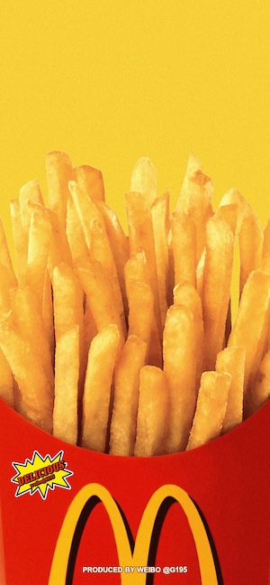 Close-up of golden McDonald's french fries in a red carton against a bright yellow background with a retro grainy texture.