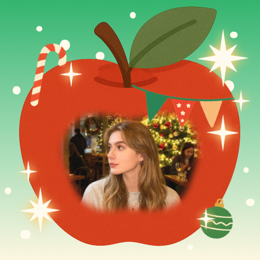 A festive red apple-shaped photo frame template with a candy cane, stars, and bunting over a green background.