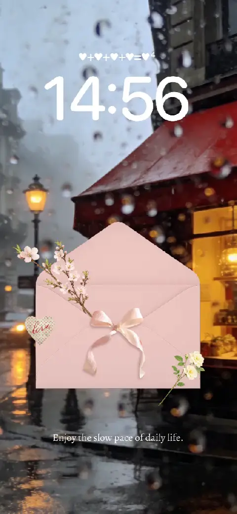 Modèle de fond d'écran animé personnalisable montrant une rue de Paris floue sous la pluie avec une enveloppe rose et des fleurs.