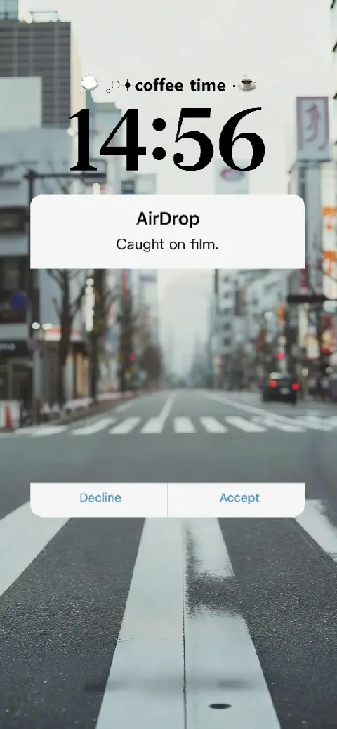 Aesthetic urban street live wallpaper template with AirDrop notification overlay and cinematic city crossing view.