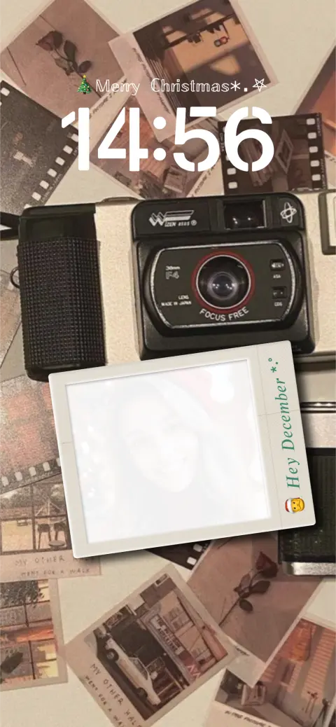 Vintage camera and Polaroid photos on a Christmas themed DIY live wallpaper template with custom photo frame.
