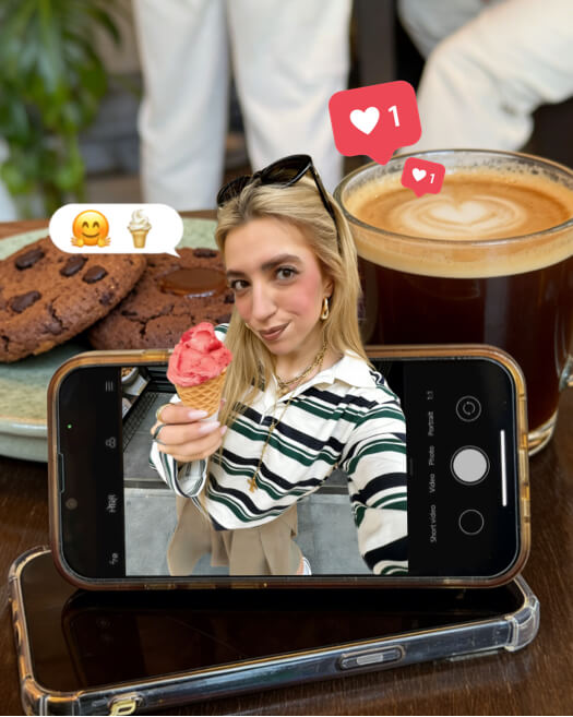 Un smartphone affichant une femme avec une glace, entouré de café, de cookies et de notifications de cœur.