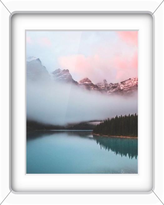 A single vertical photo frame with a white 3D bezel featuring a landscape of misty mountains and a calm blue lake at sunset.